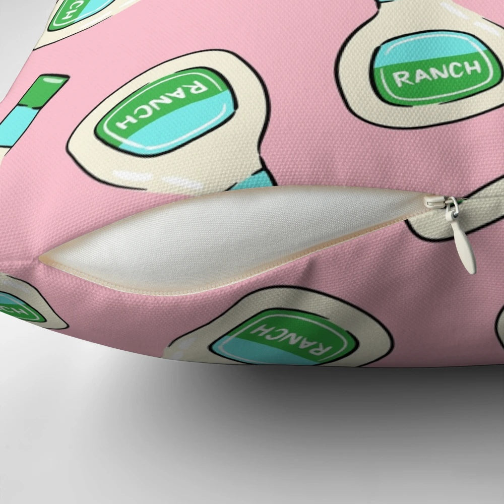 A soft, pink pillow featuring a ranch salad dressing bottle design by Little Arrow Designs.