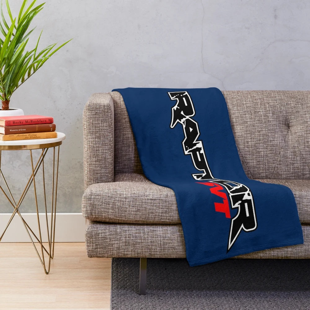 Raptor-inspired plush blanket featuring a pickup truck design