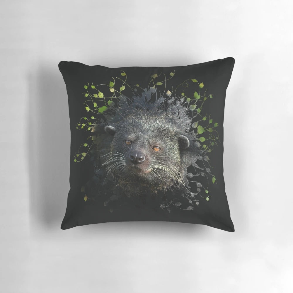 Binturong (Bearcat) peeking through the leaves on a decorative pillow