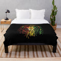 Rastafarian plush blanket featuring a colorful print of the Lion of Judah, a symbol of Rastafarian and Jamaican culture