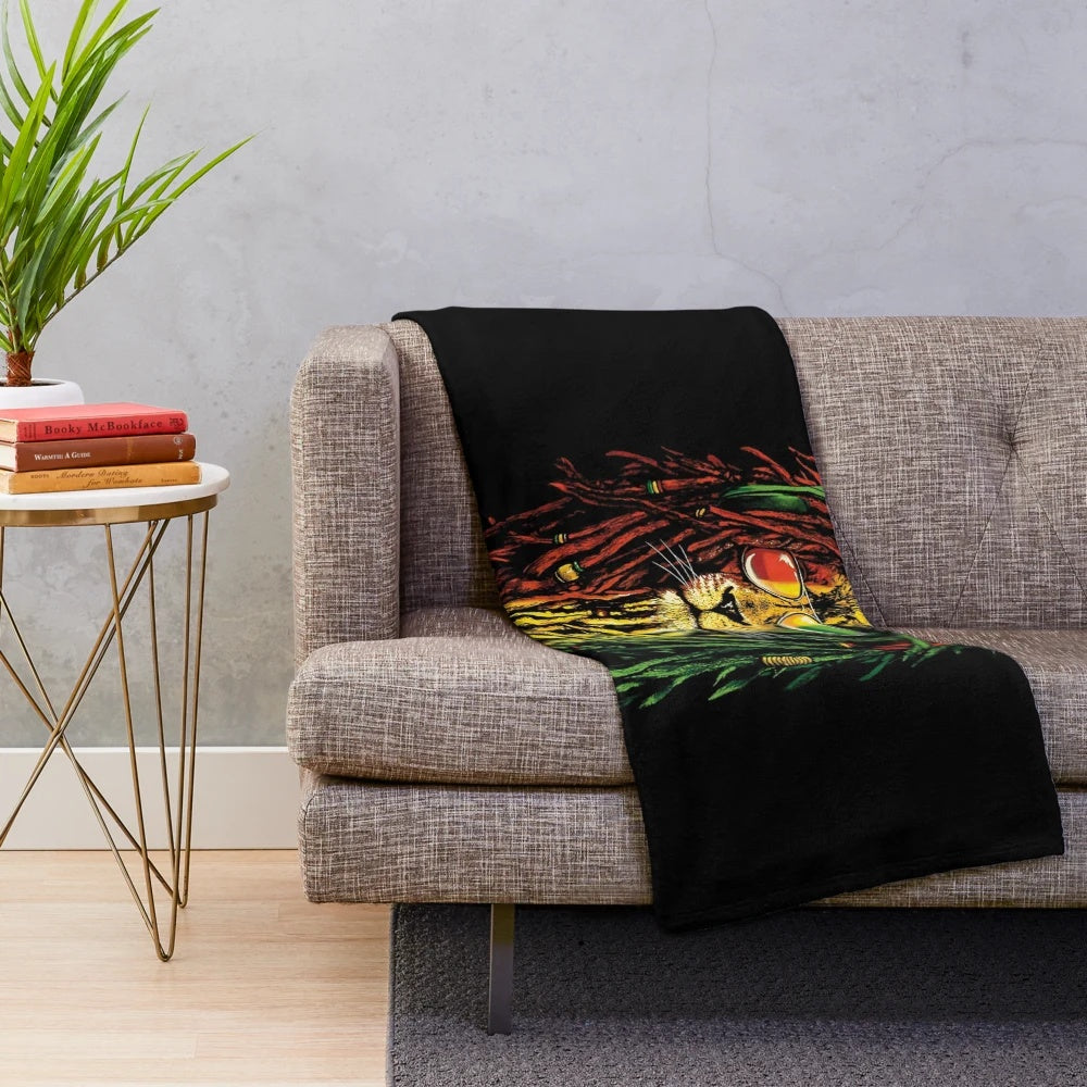 Rastafarian plush blanket featuring a colorful print of the Lion of Judah, a symbol of Rastafarian and Jamaican culture