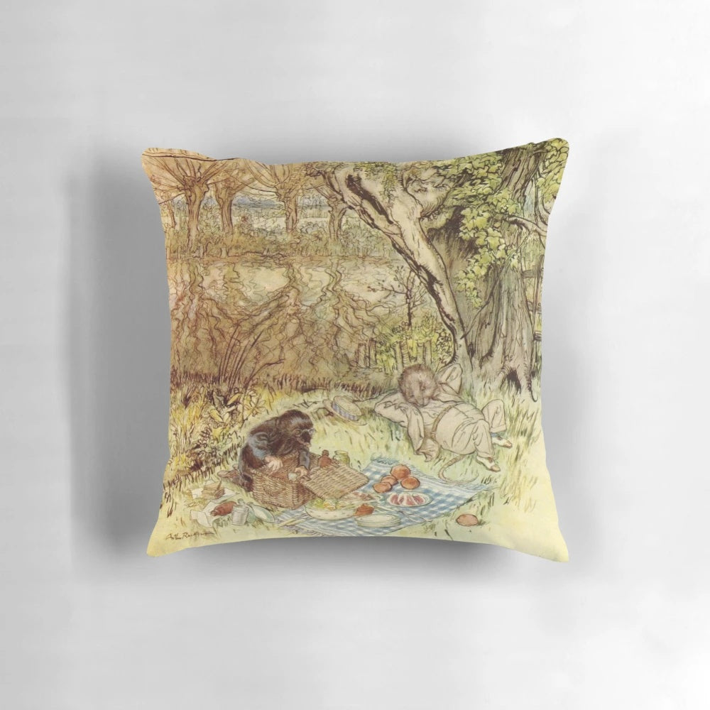 Decorative pillow featuring a classic illustration of Rat and Mole having a picnic from The Wind in the Willows by Arthur Rackham.
