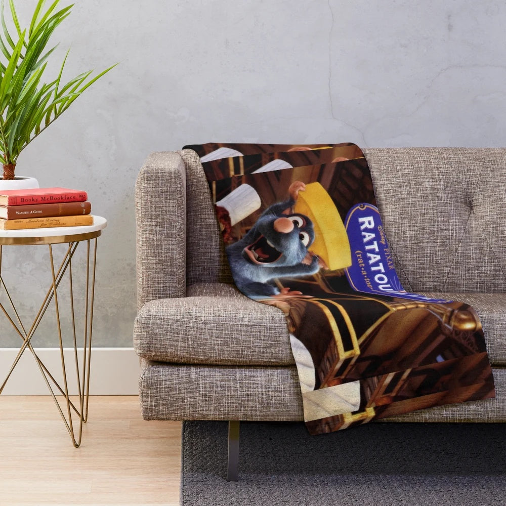 Ratatouille-inspired plush blanket featuring the logo and characters from the beloved Pixar animated film