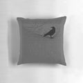 A decorative pillow with the iconic raven design and text from Edgar Allan Poe's famous poem "The Raven