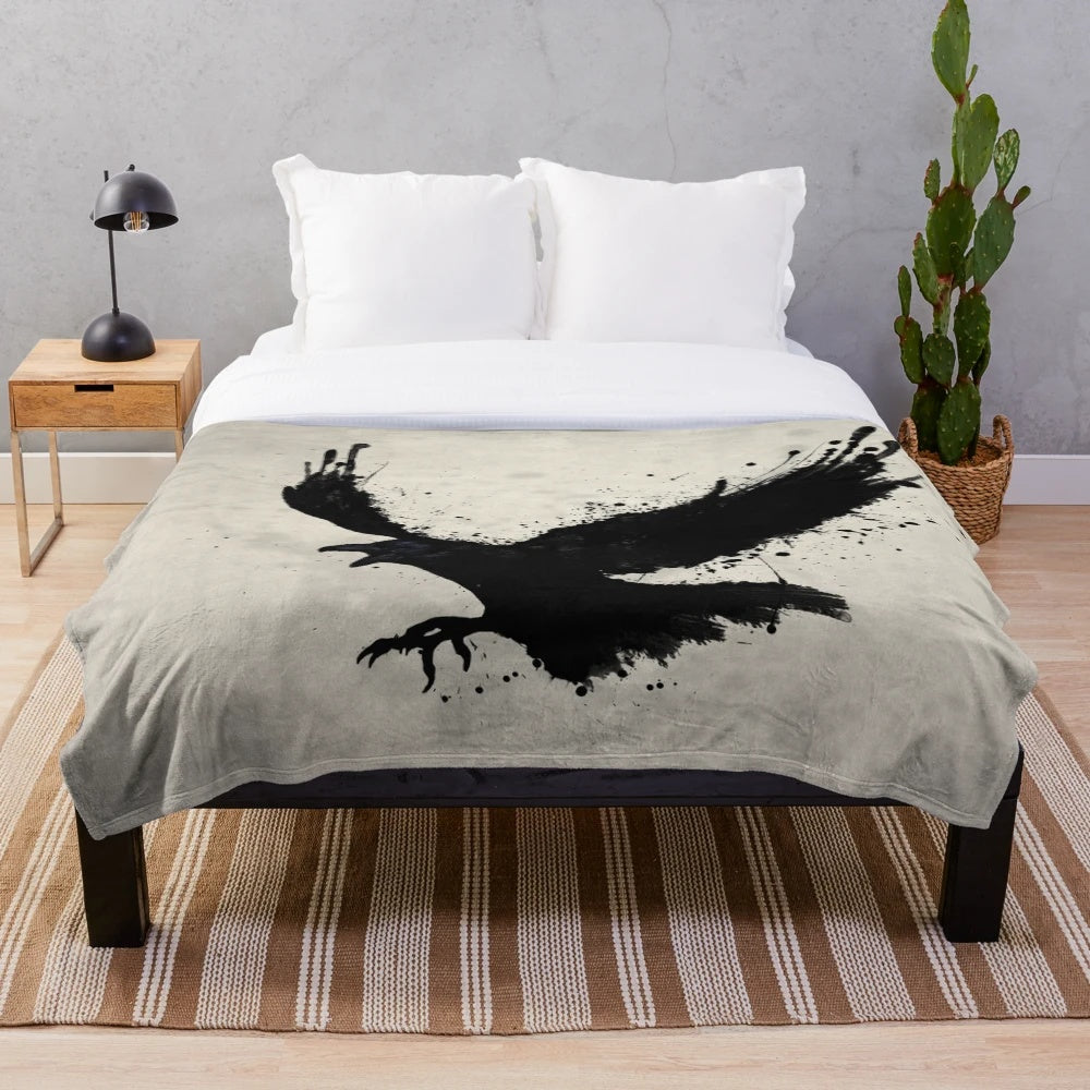 Raven-inspired plush blanket with bird sketch, spatter, and drip design
