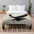 Raven-inspired plush blanket with bird sketch, spatter, and drip design