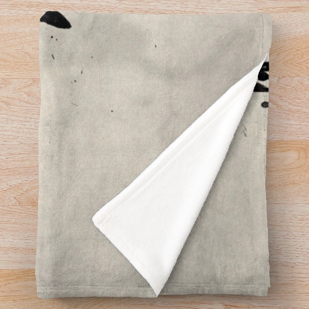 Raven-inspired plush blanket with bird sketch, spatter, and drip design
