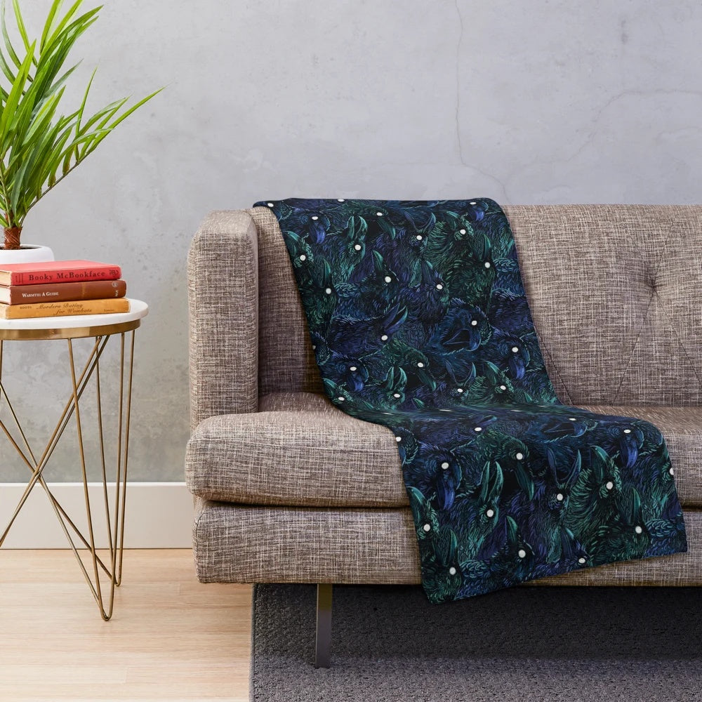 Raven pattern plush blanket with dark, mysterious design