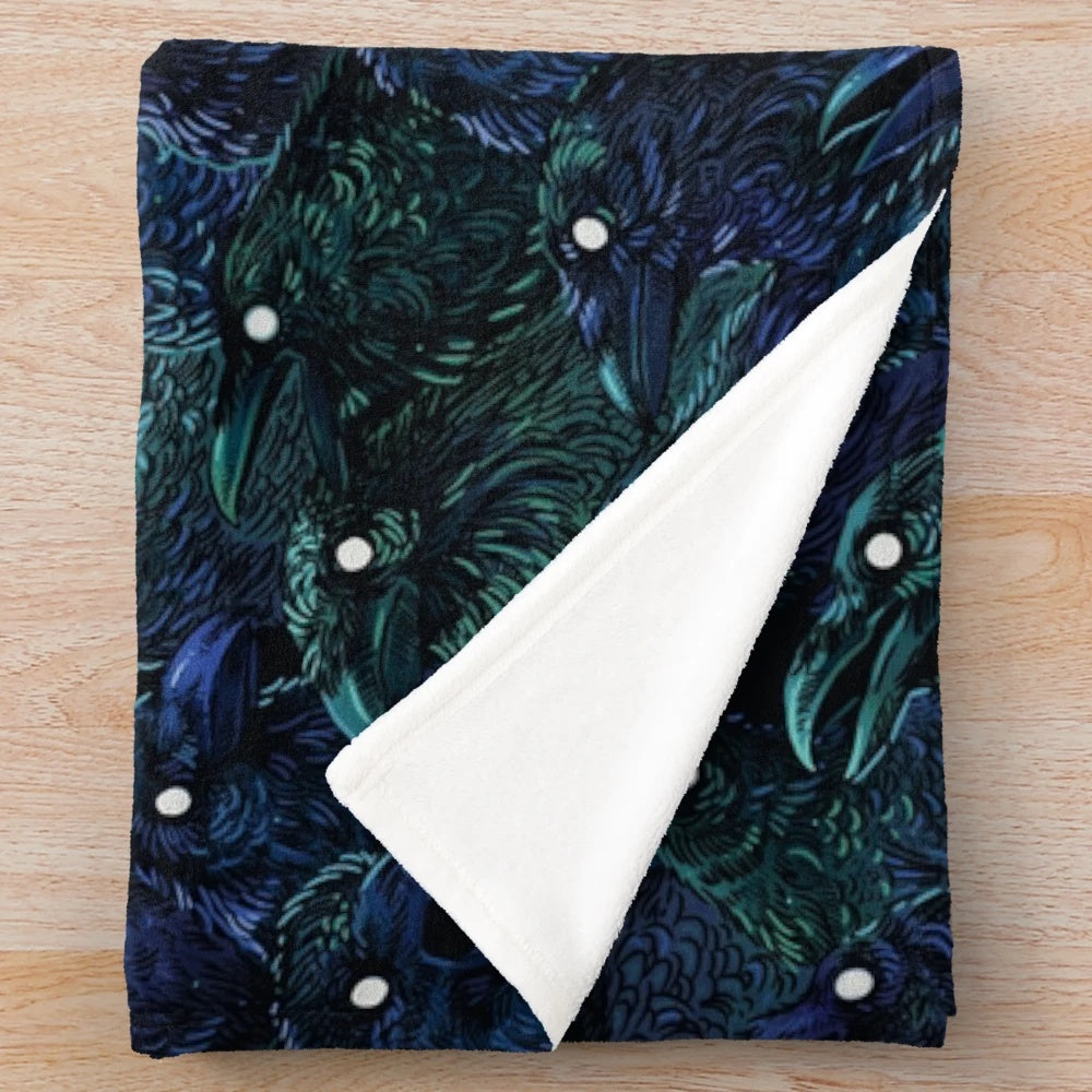 Raven pattern plush blanket with dark, mysterious design
