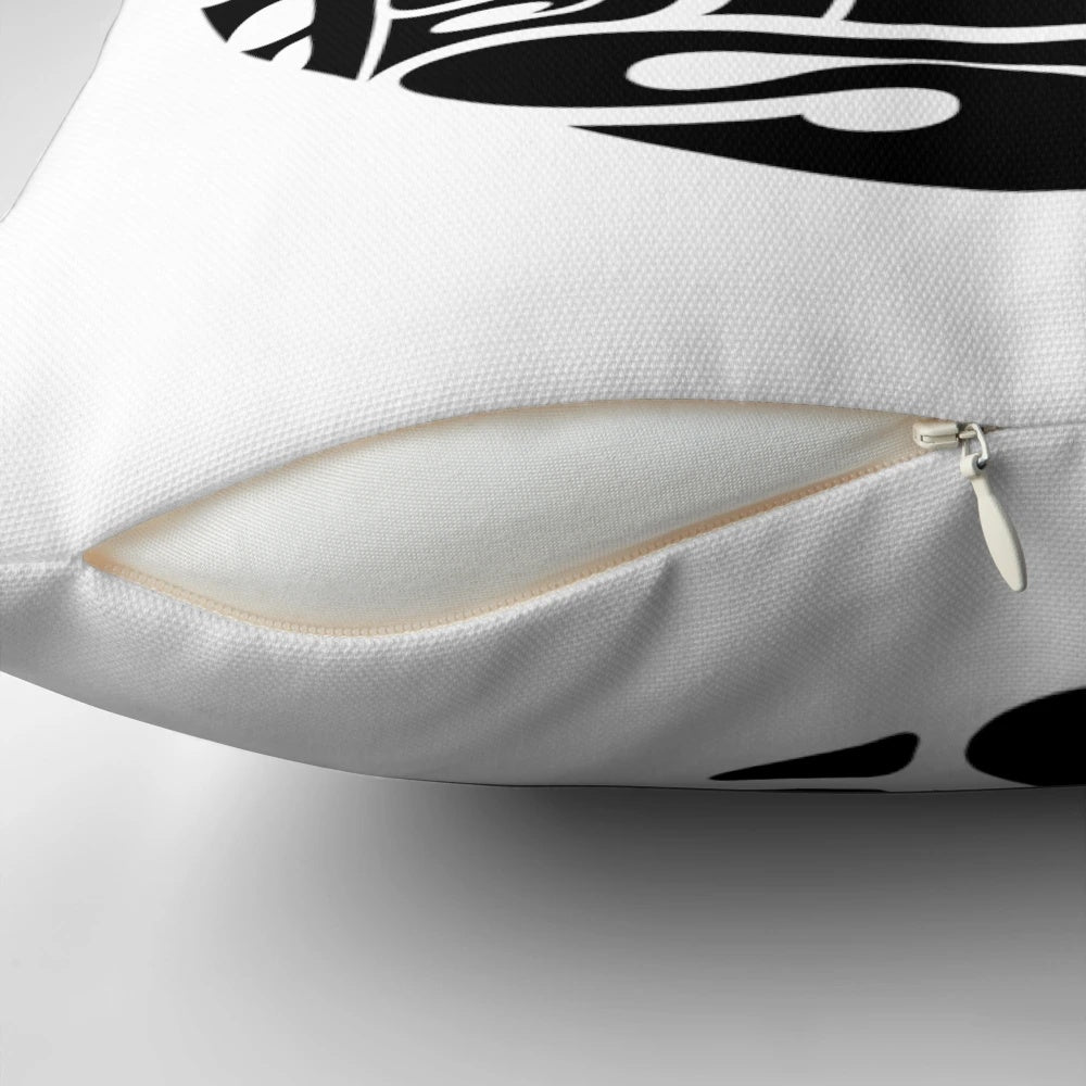 A decorative pillow featuring the lyrics "Is this the real life? Is this just fantasy?" from the Queen song "Bohemian Rhapsody
