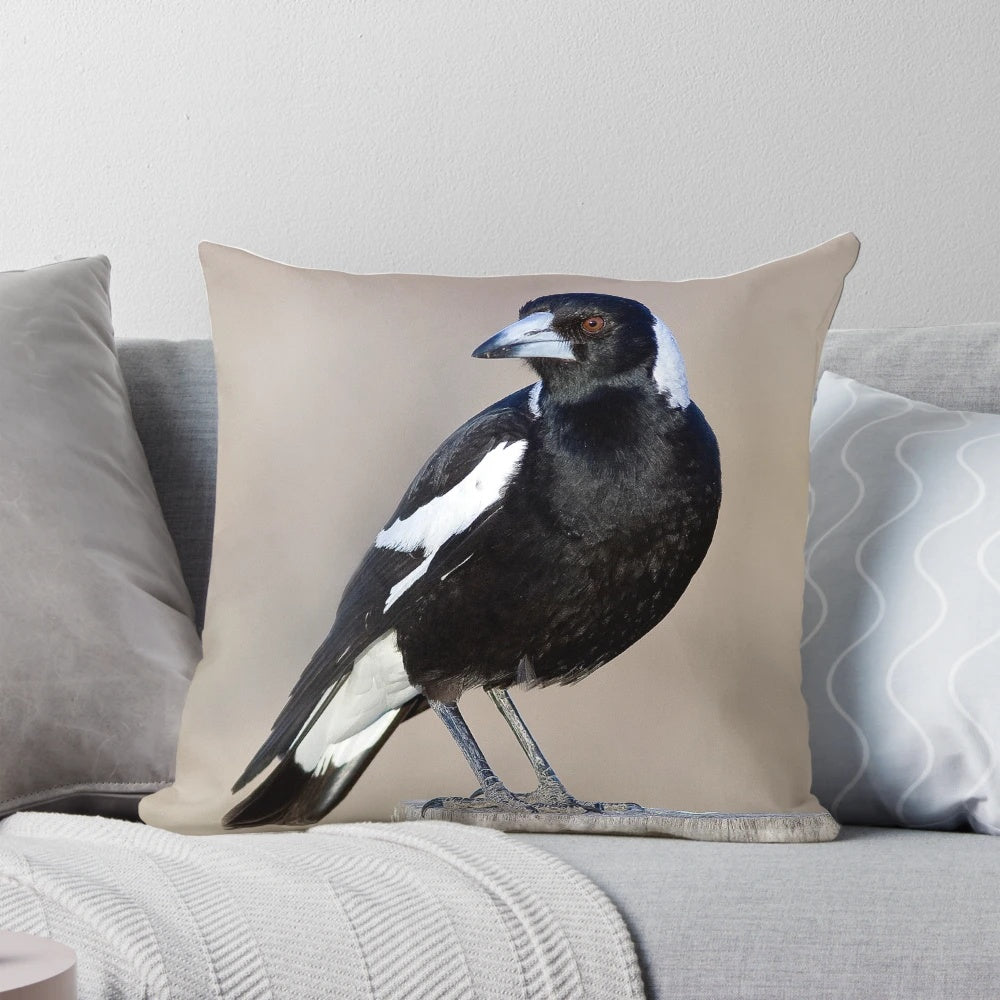 Decorative throw pillow featuring a detailed illustration of an Australian magpie bird