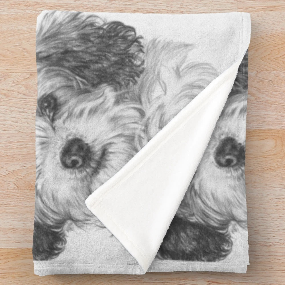 Realistic Bichon Cavalier pet portrait on a plush blanket