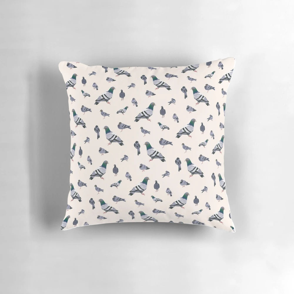 A decorative throw pillow featuring a lifelike watercolor design of bird poo or pigeon droppings.