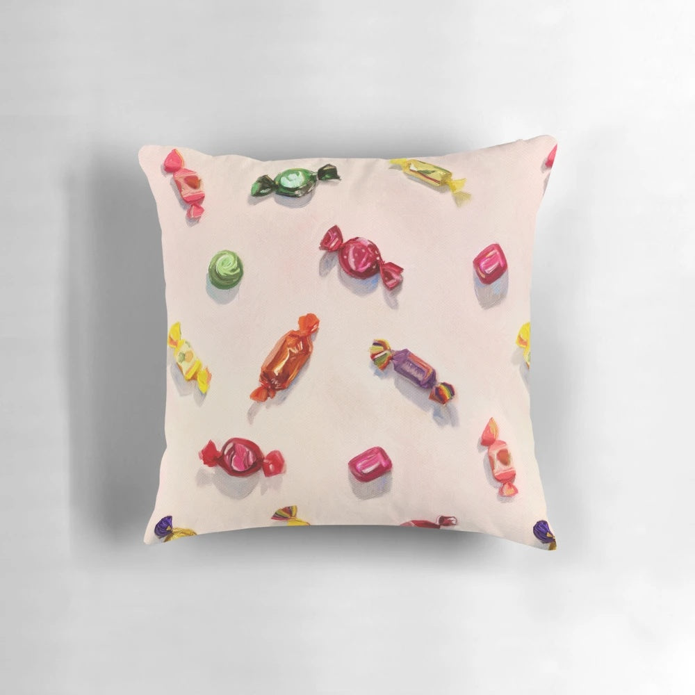 A colorful and sweet candy-inspired throw pillow featuring a realistic painted pattern design.