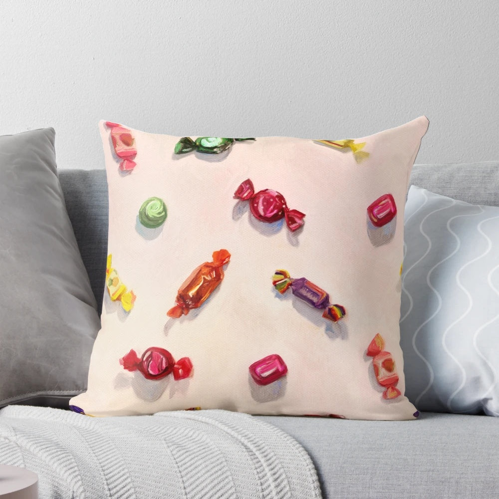 A colorful and sweet candy-inspired throw pillow featuring a realistic painted pattern design.