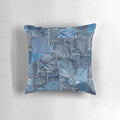 Photograph of a close-up view of a distressed and washed denim jeans pocket with a patchwork pattern, perfect for design projects.