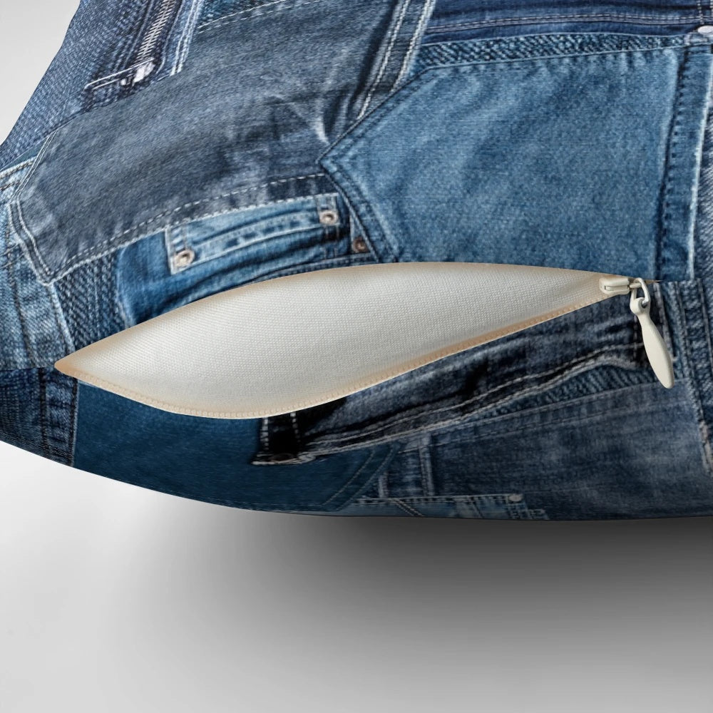 Photograph of a close-up view of a distressed and washed denim jeans pocket with a patchwork pattern, perfect for design projects.