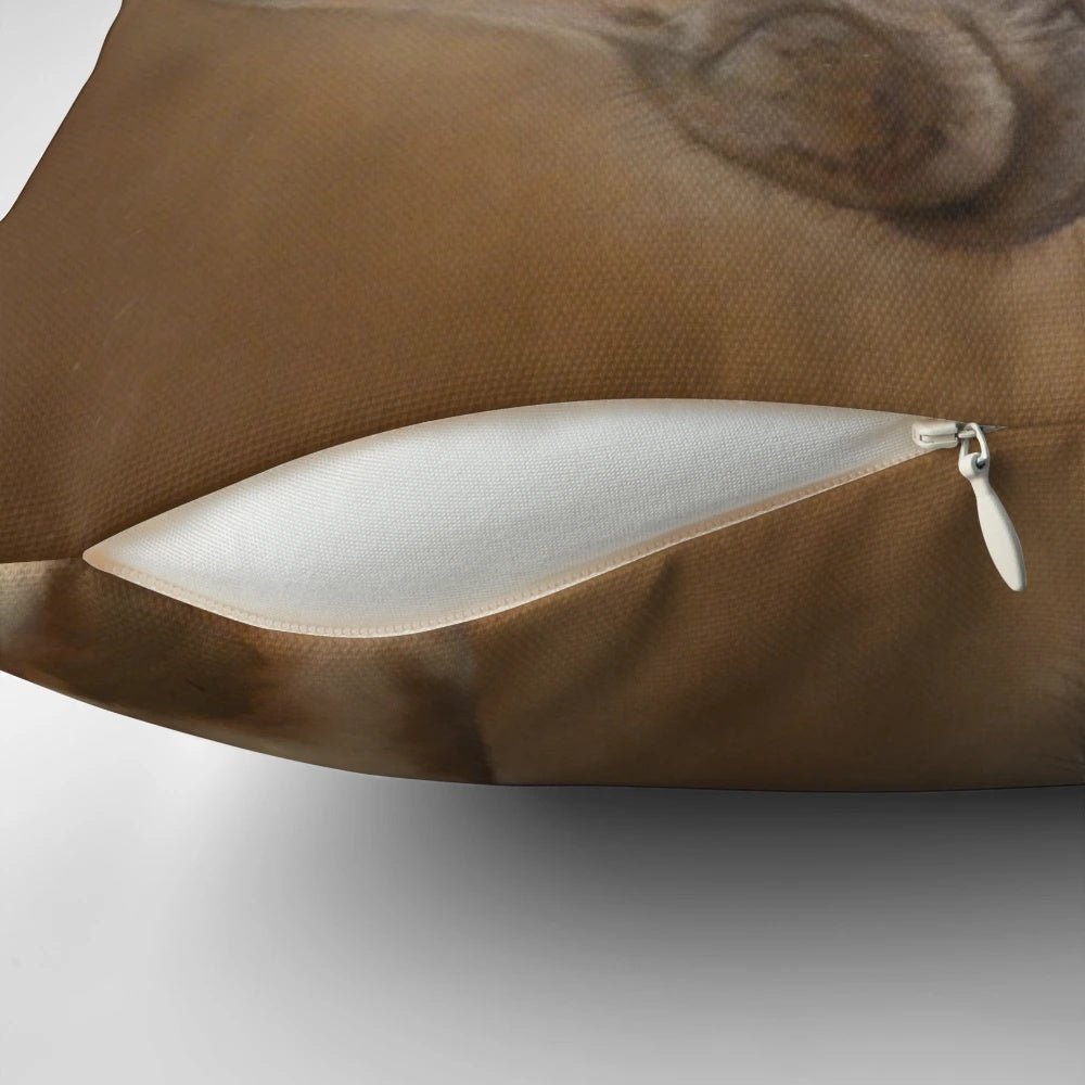 Closeup of a detailed giraffe illustration printed on a plush throw pillow