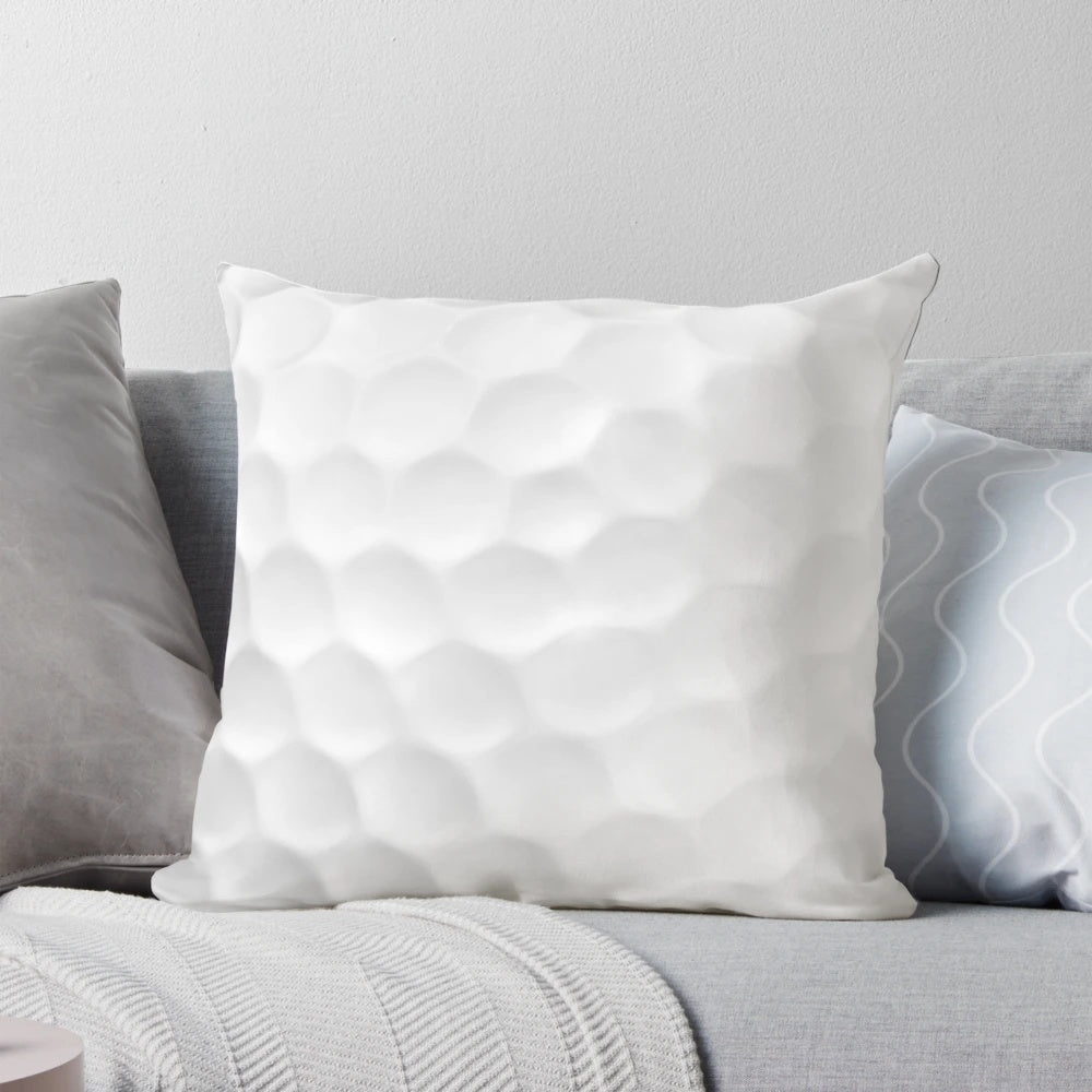 Soft, white golf ball shaped throw pillow for golf home decor