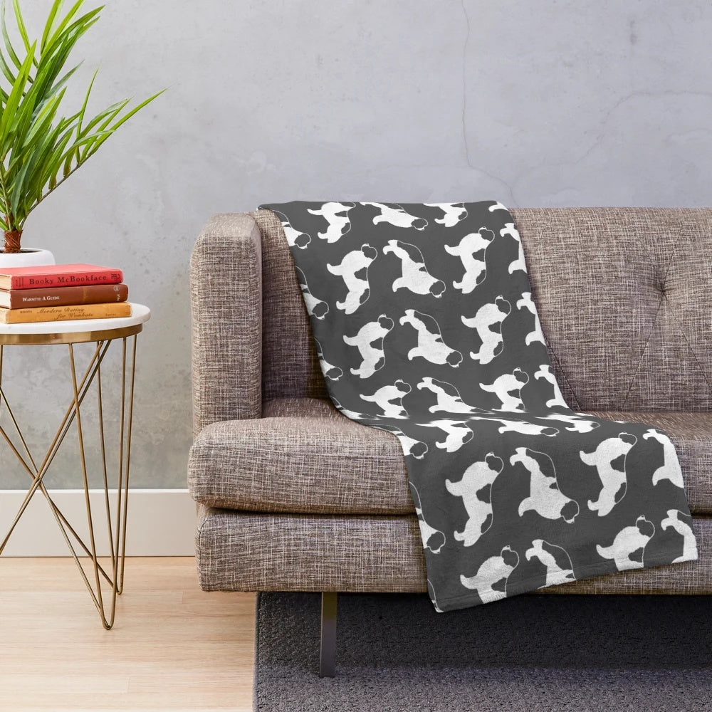 Newfoundland Landseer dog breed silhouette design on a soft, plush blanket