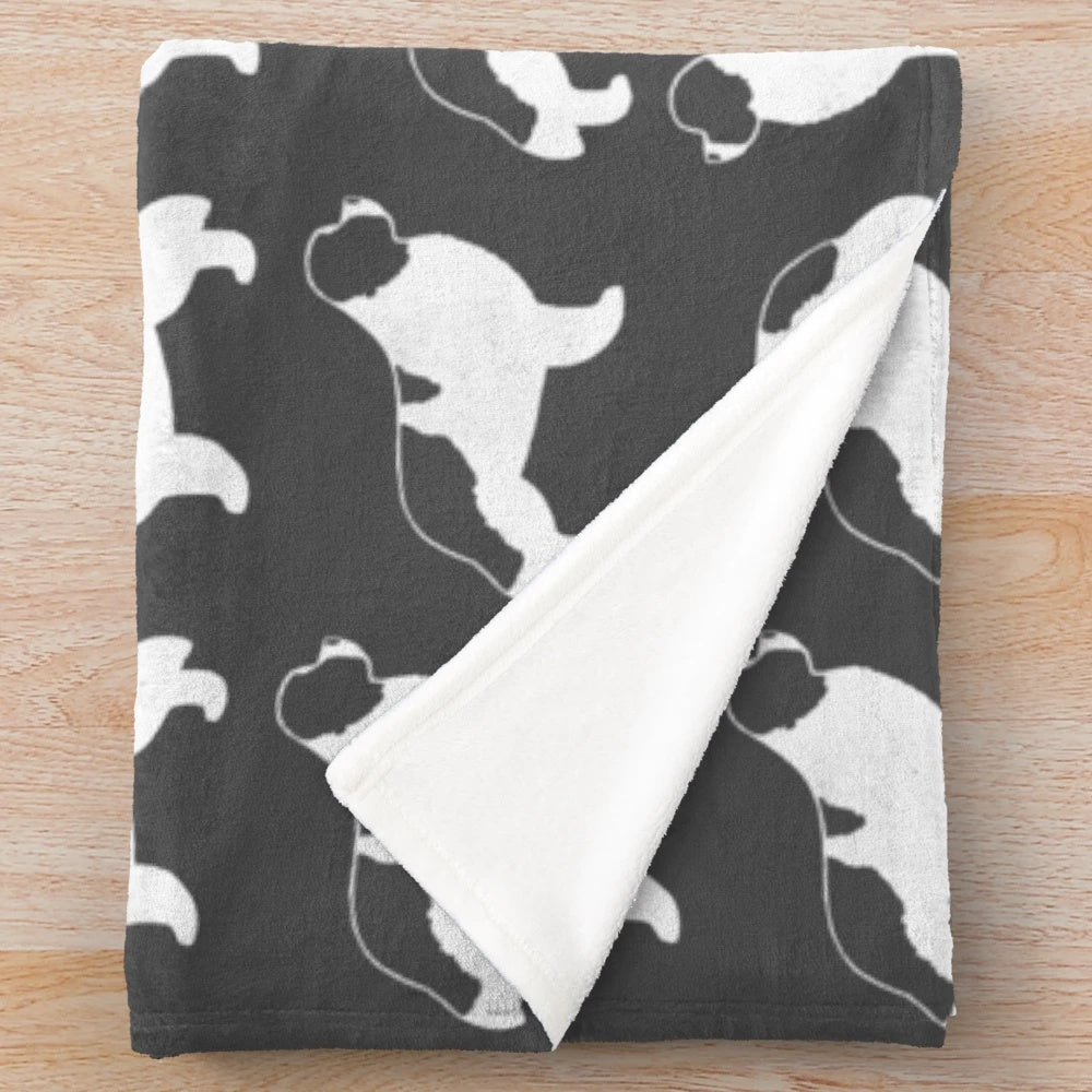 Newfoundland Landseer dog breed silhouette design on a soft, plush blanket