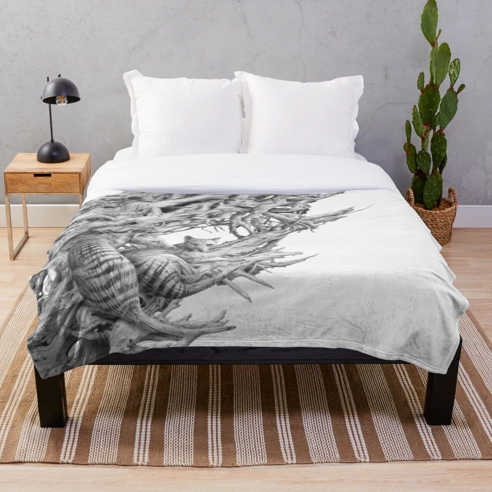 Realistic black and white drawing of a Tasmanian tiger on a driftwood-inspired plush blanket