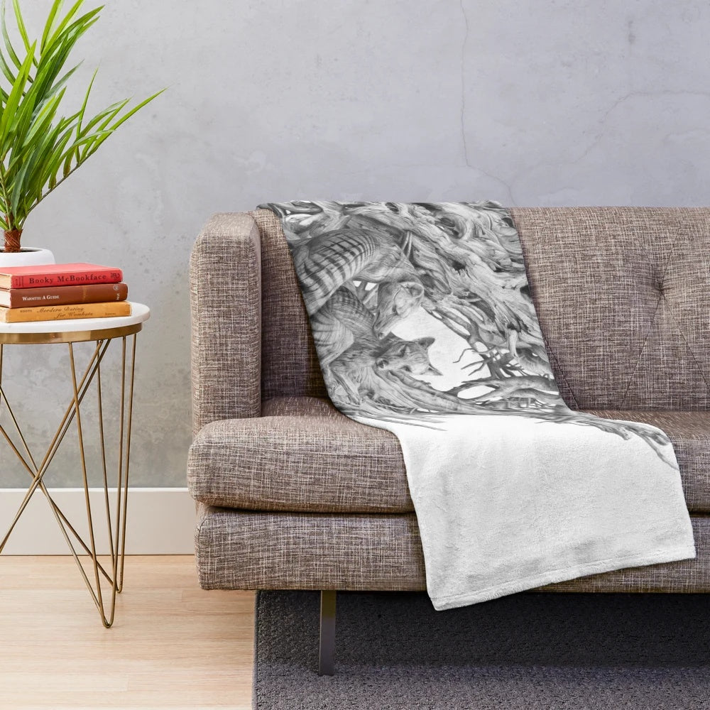 Realistic black and white drawing of a Tasmanian tiger on a driftwood-inspired plush blanket