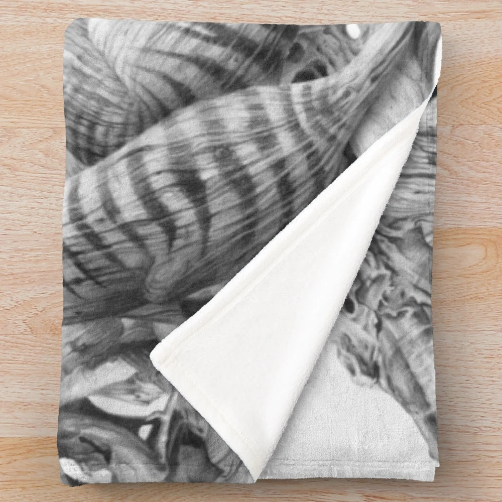 Realistic black and white drawing of a Tasmanian tiger on a driftwood-inspired plush blanket