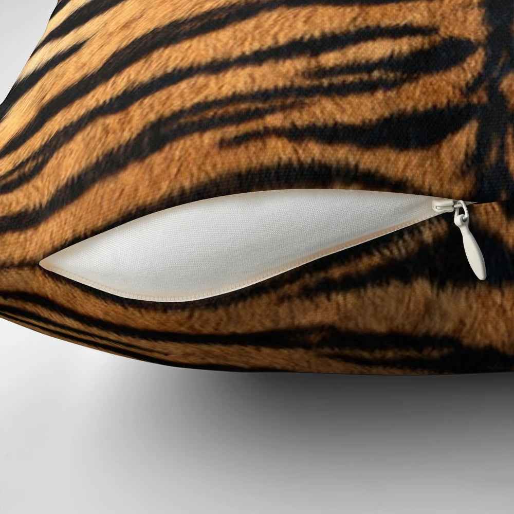 Closeup of a realistic tiger print decorative pillow with an orange and black striped pattern