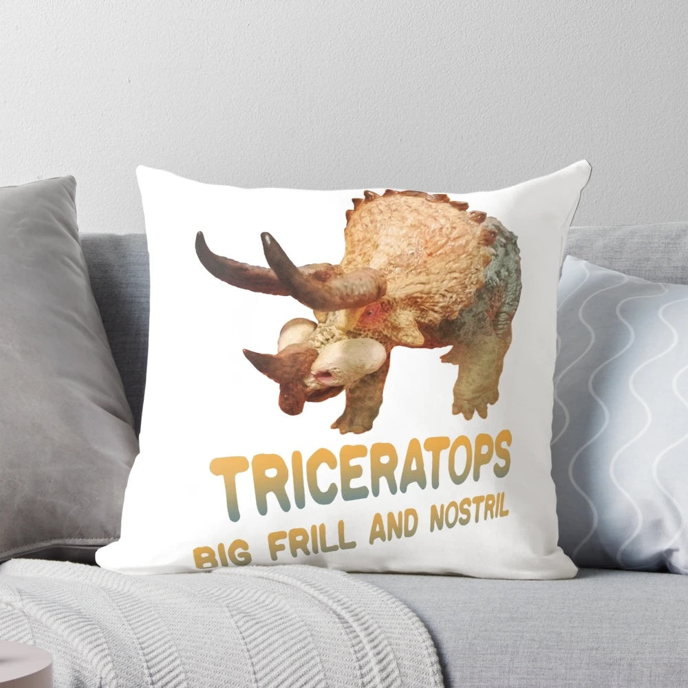 Plush triceratops dinosaur-shaped pillow with textured scales and horns
