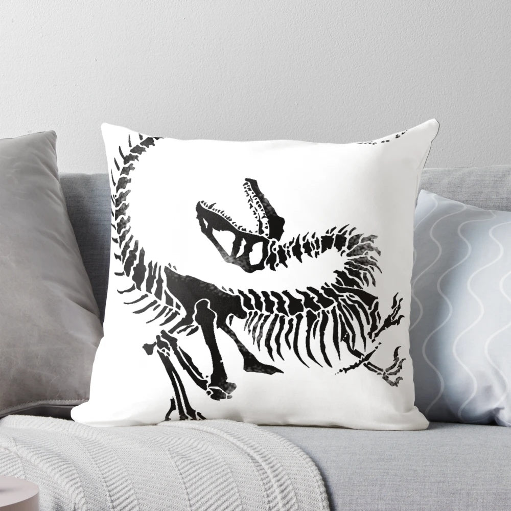 Realistic print of a velociraptor dinosaur skeleton on a decorative throw pillow.
