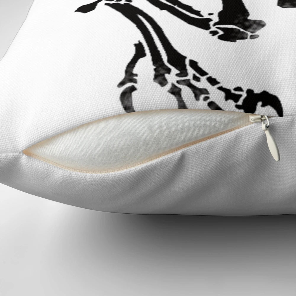 Realistic print of a velociraptor dinosaur skeleton on a decorative throw pillow.