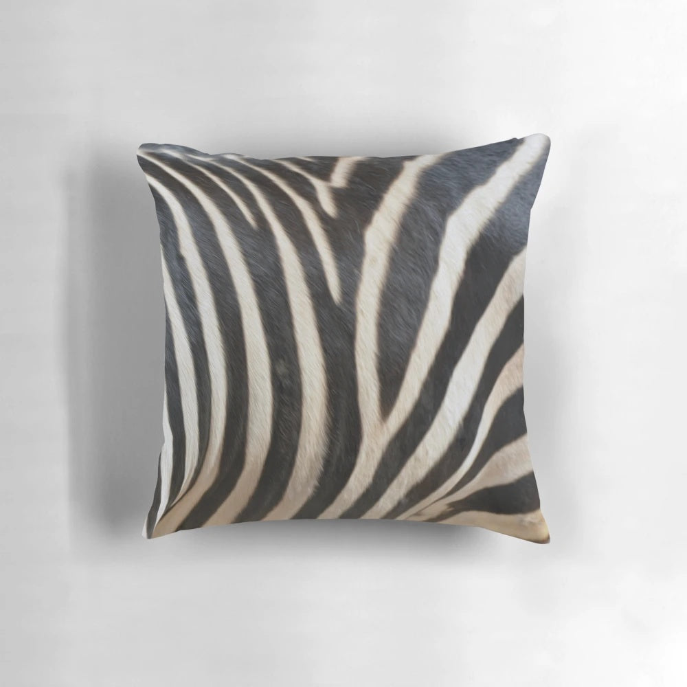 Close-up image of a realistic zebra patterned pillow, showcasing the intricate black and white stripes.