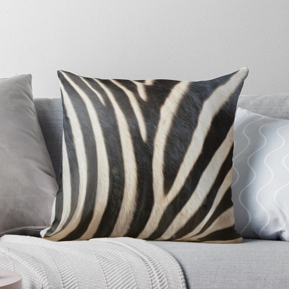 Close-up image of a realistic zebra patterned pillow, showcasing the intricate black and white stripes.