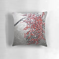 Red, black, and silver cherry blossom tree art design on a decorative accent pillow