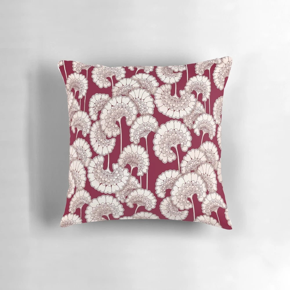 Red decorative pillow featuring a floral design inspired by the iconic patterns of Florence Broadhurst.