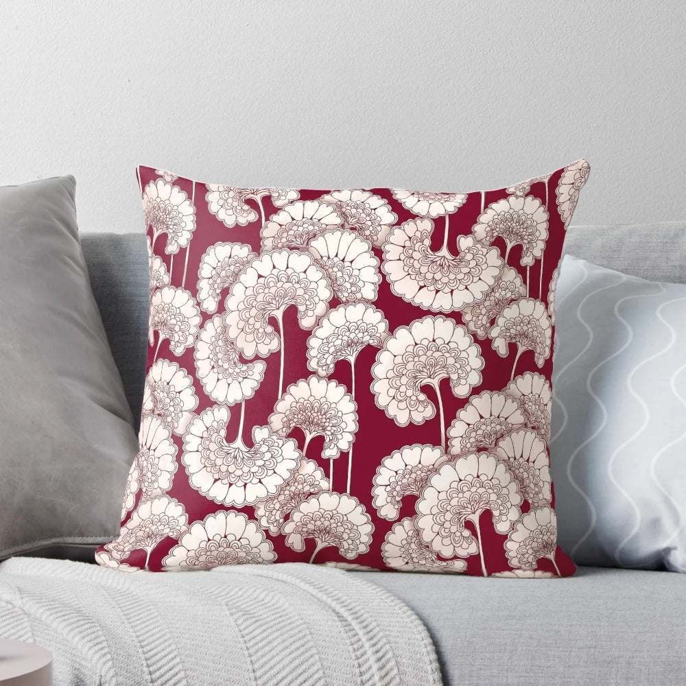 Red decorative pillow featuring a floral design inspired by the iconic patterns of Florence Broadhurst.