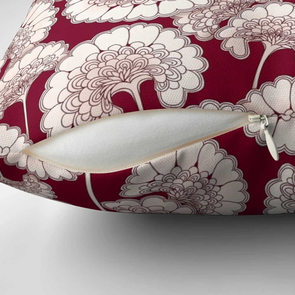 Red decorative pillow featuring a floral design inspired by the iconic patterns of Florence Broadhurst.