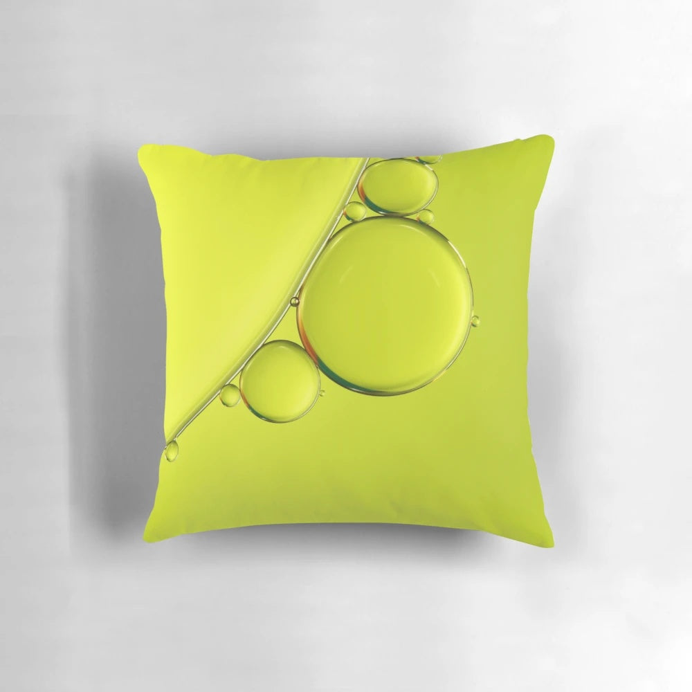 Closeup of a simple, lime-colored pillow with abstract bubbles and a minimalist design