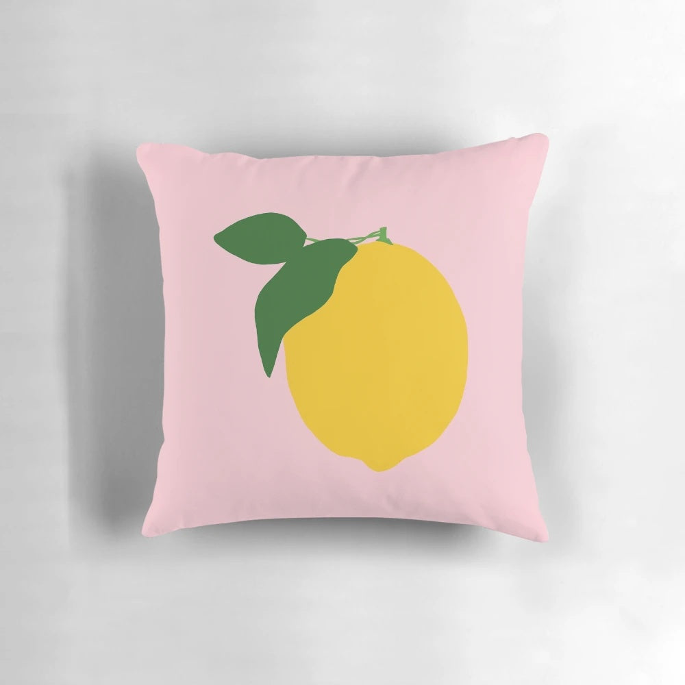 Pink lemonade-inspired decorative throw pillow with lemon and floral design