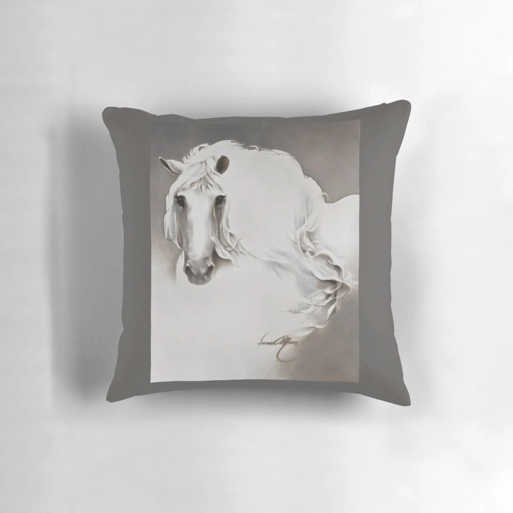 White pillow with a queen and horse design