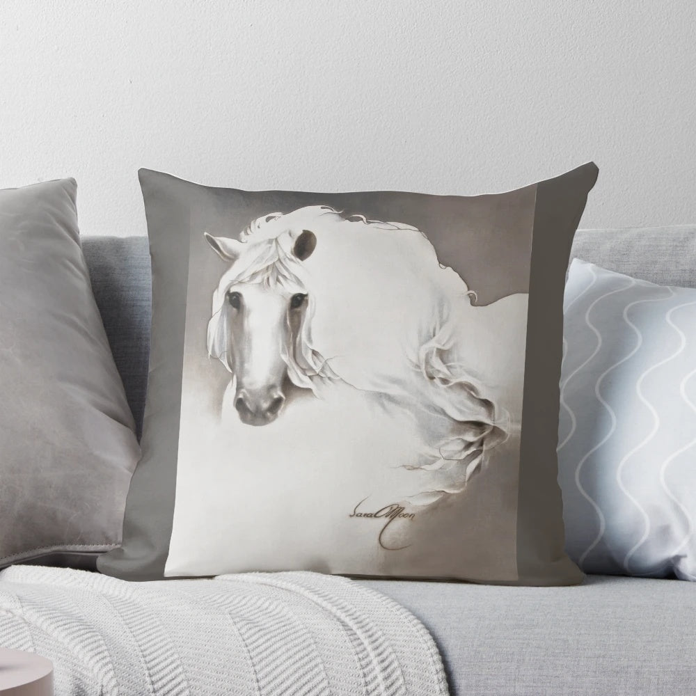 White pillow with a queen and horse design