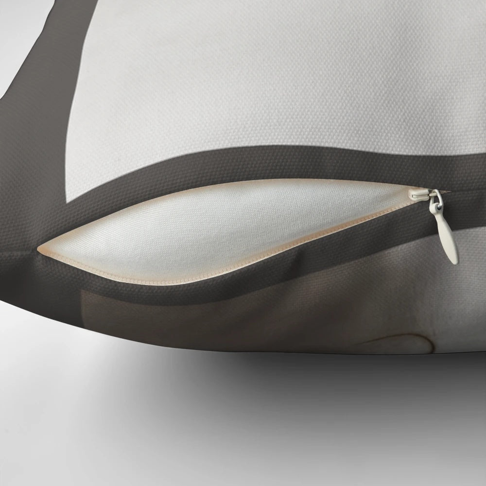 White pillow with a queen and horse design