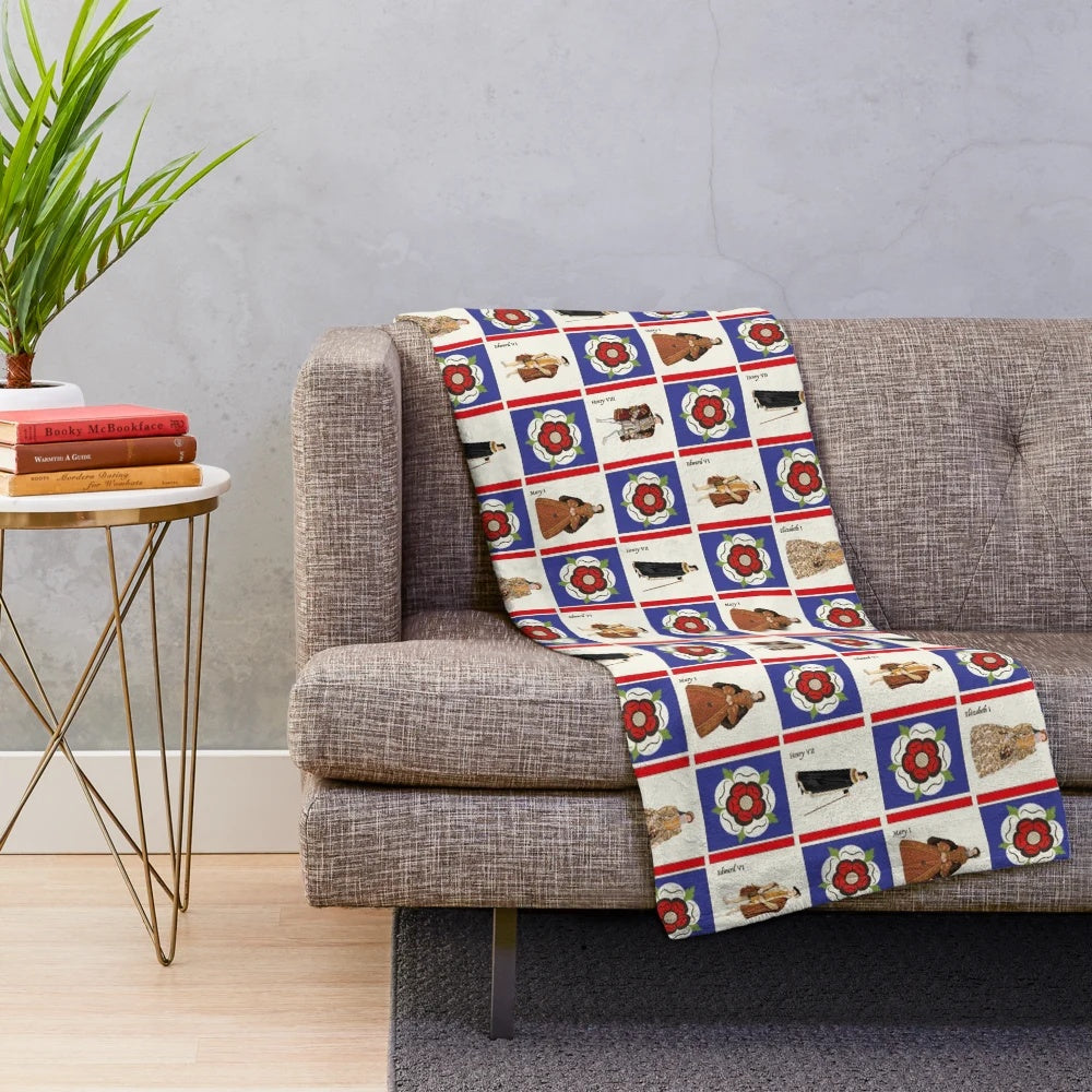 Tudor-inspired plush blanket with floral and royal design