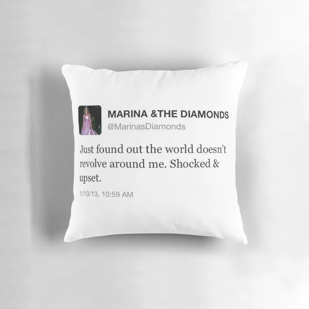 A pillow featuring a screenshot of a relatable tweet from the singer Marina and the Diamonds.