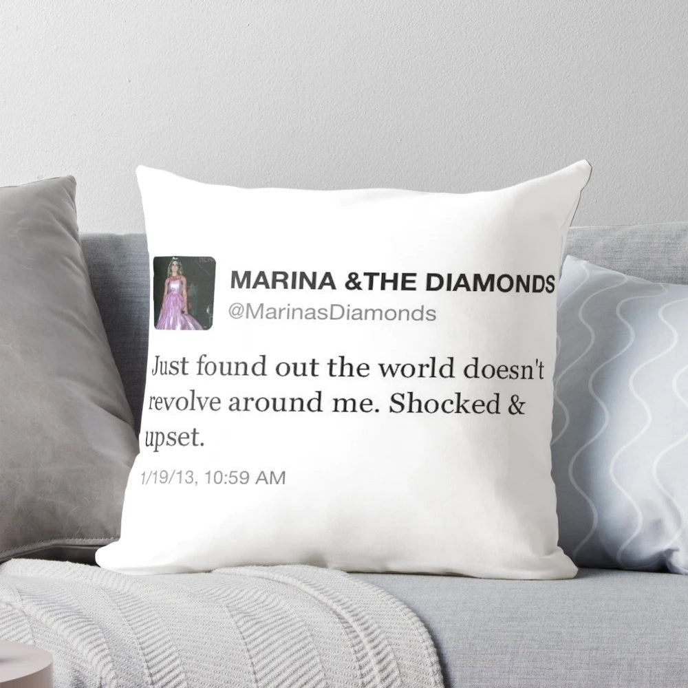 A pillow featuring a screenshot of a relatable tweet from the singer Marina and the Diamonds.