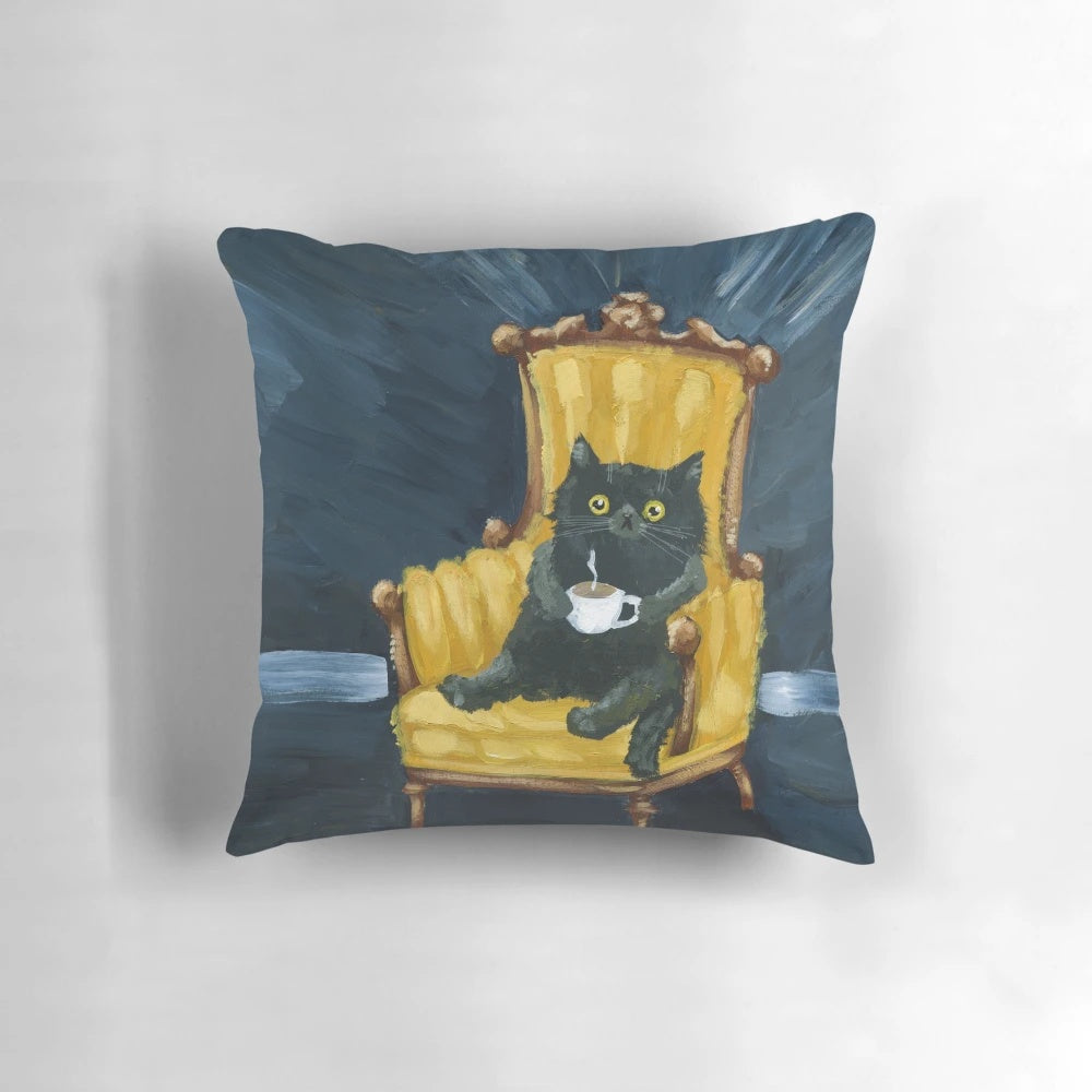 A cozy pillow featuring a black cat lounging with a cup of coffee, capturing the essence of Monday moods.