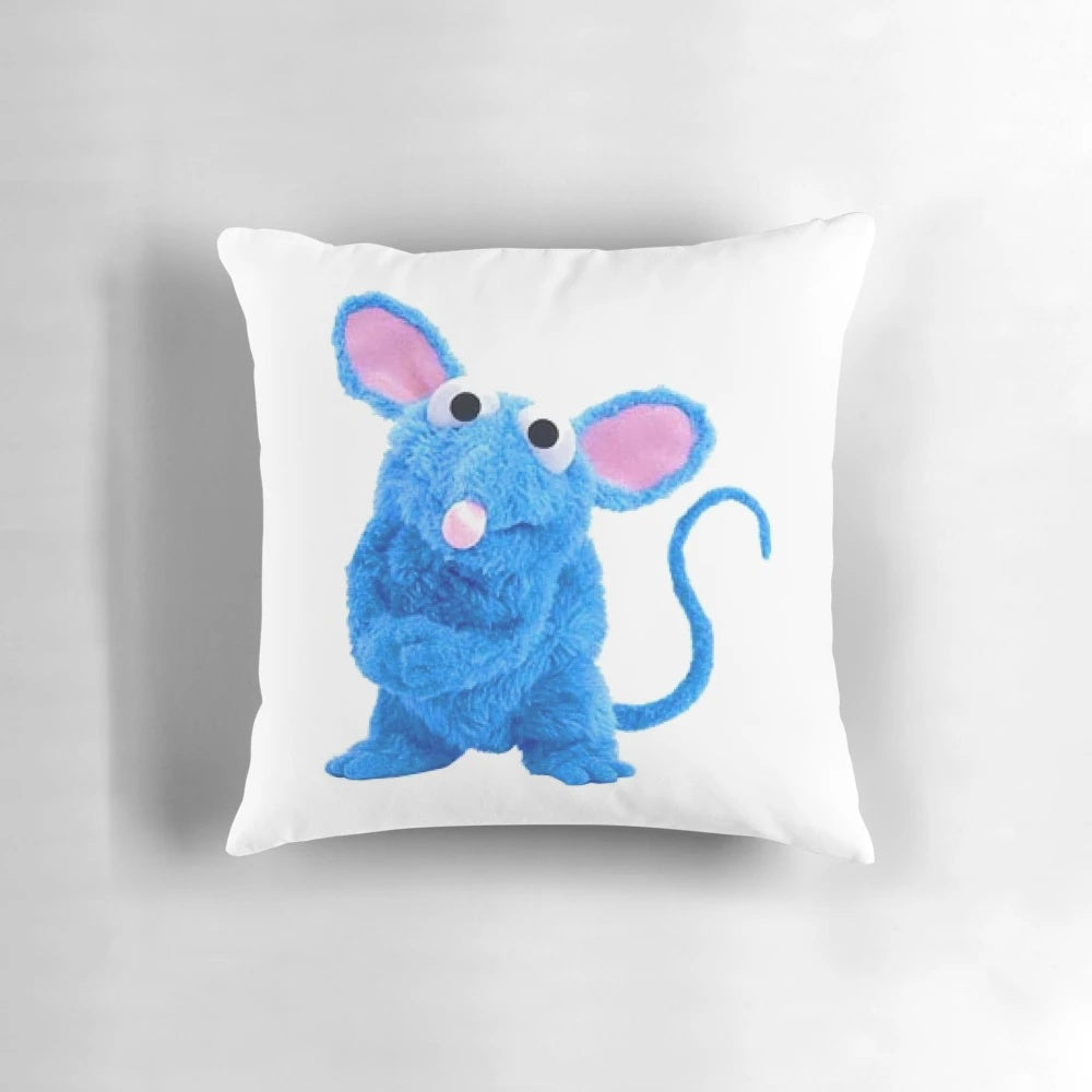 Tutter the mouse with glasses relaxing on a blue pillow