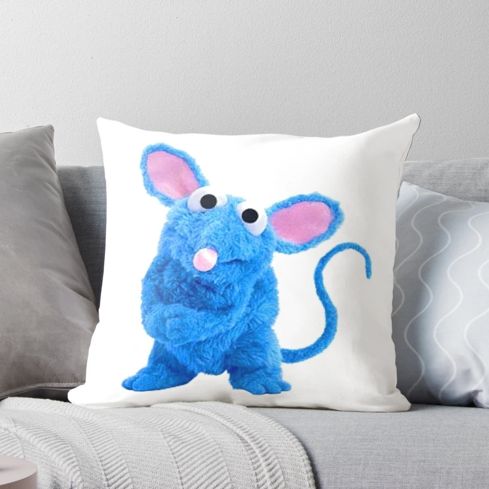 Tutter the mouse with glasses relaxing on a blue pillow