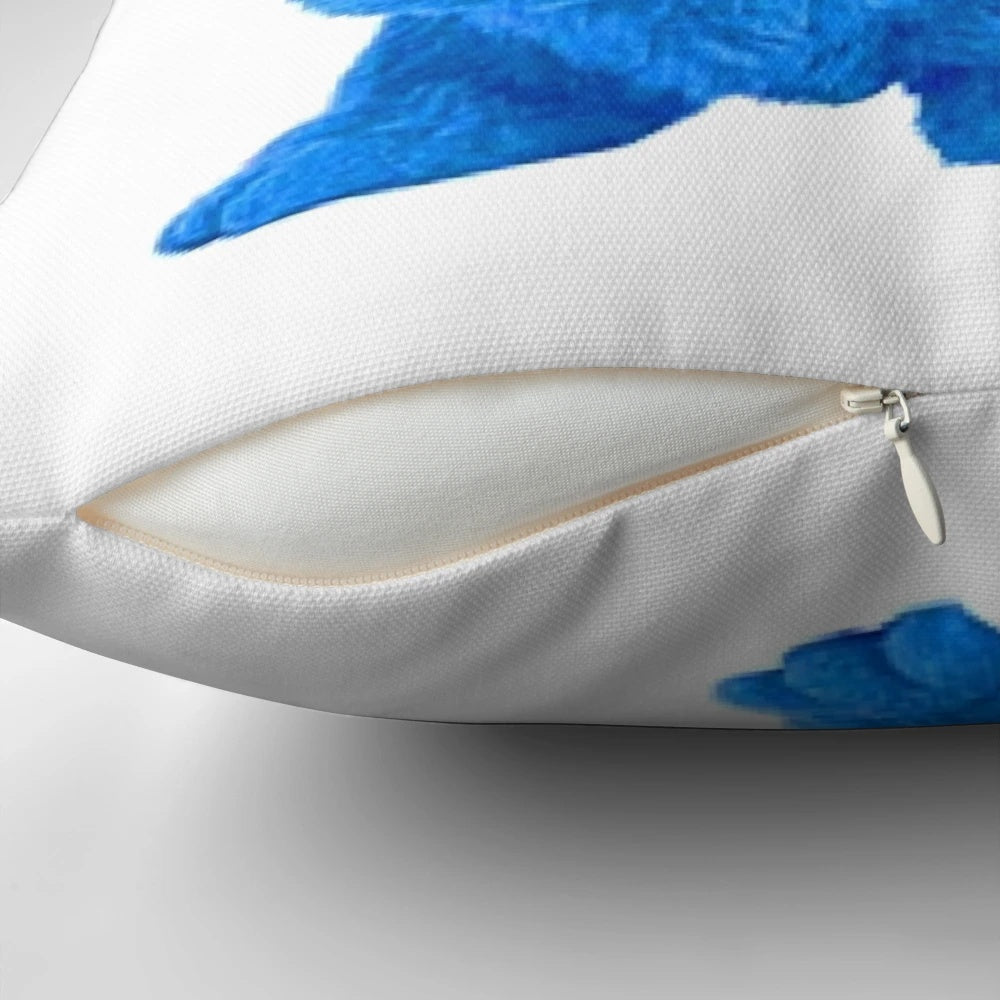 Tutter the mouse with glasses relaxing on a blue pillow